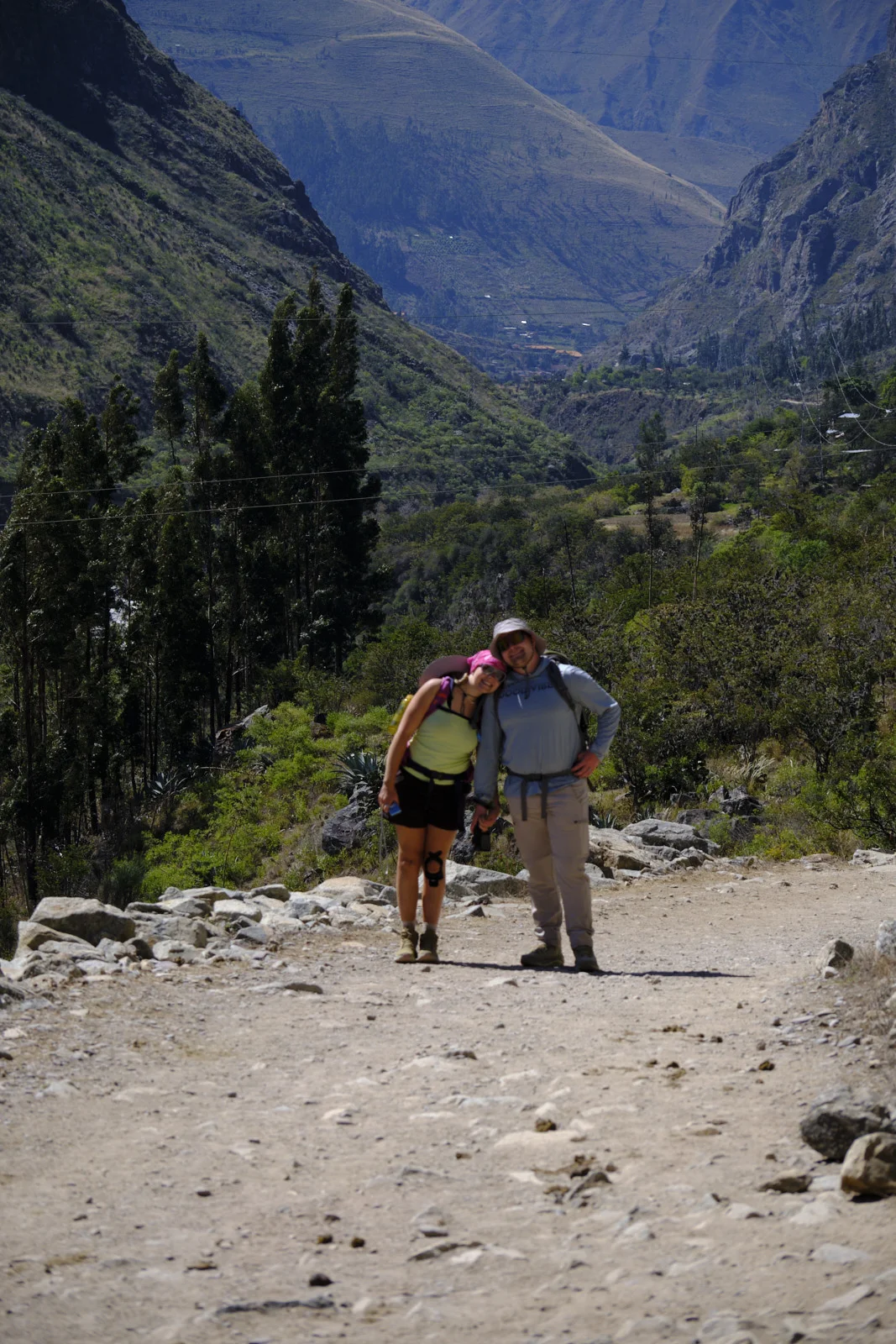 Rocky stretch of the day-1 trail looking back down the Urubamba valley past eucalyptus and dry slopes