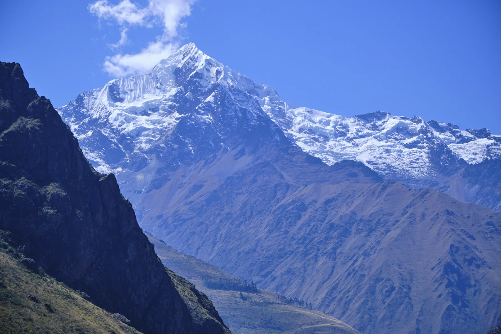Nevado Veronica from the trail, snow and glacier on the peak above brown ridgelines