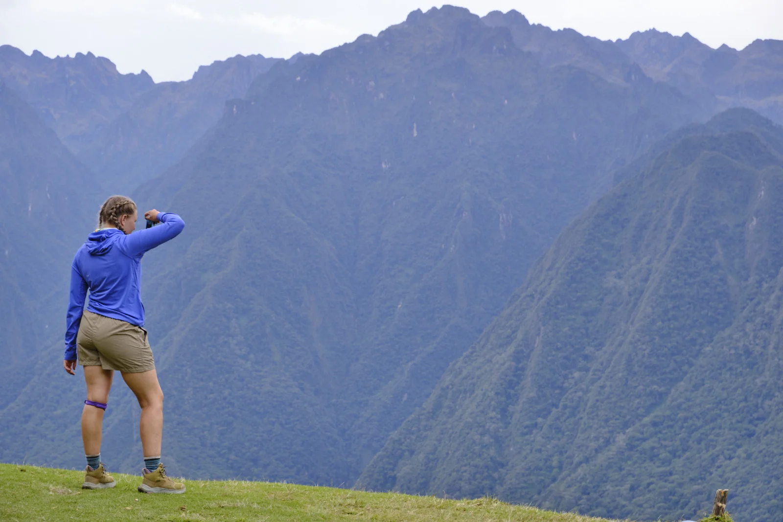Forested ridgelines across the Urubamba canyon, from a grassy terrace near Intipata