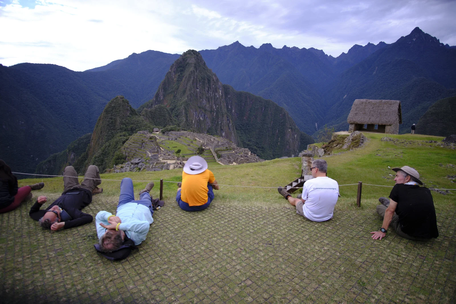 Upper terrace viewpoint at Machu Picchu, the thatched Guardhouse at right and Huayna Picchu behind the citadel
