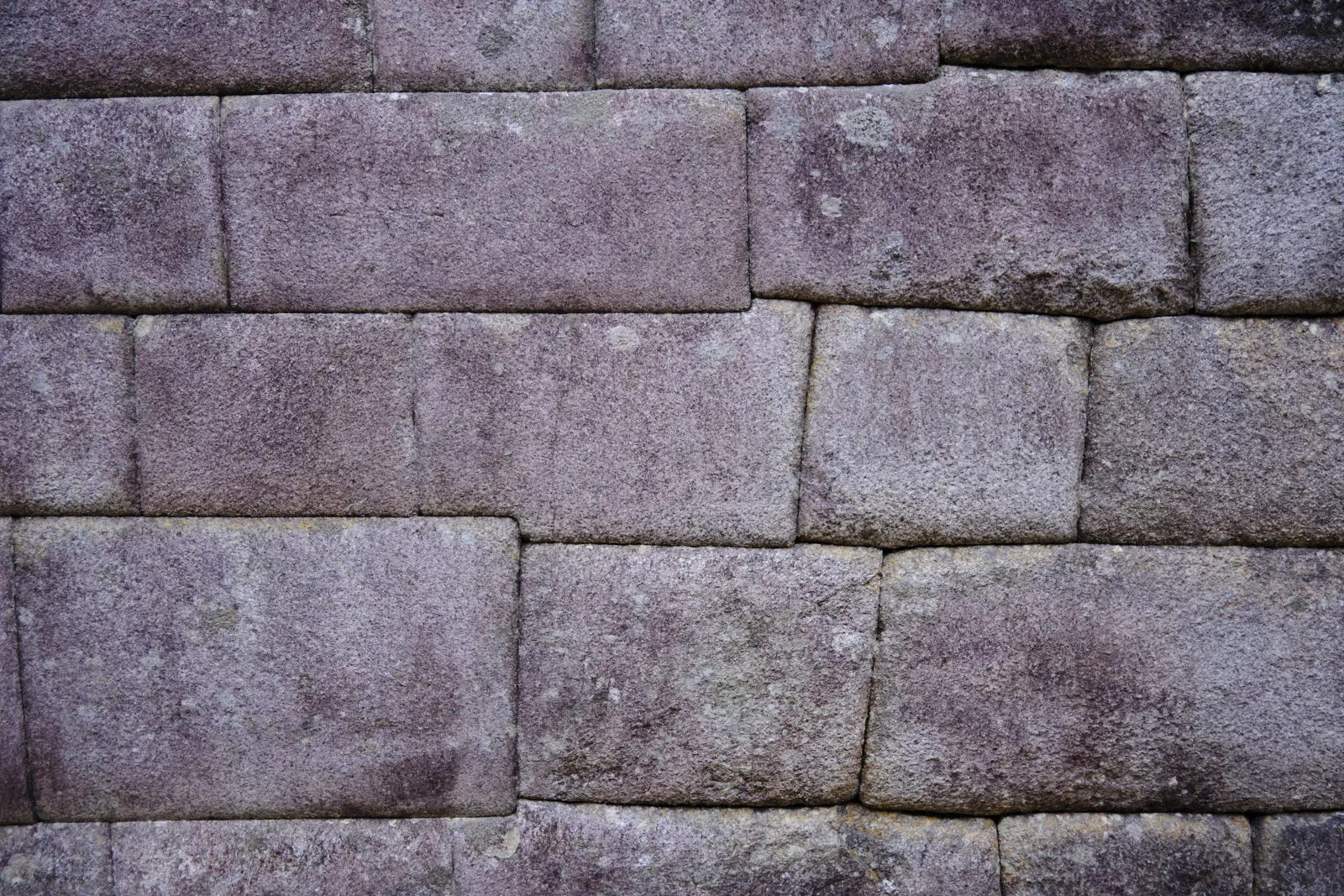 Fine granite ashlar of the Temple of the Sun at Machu Picchu, tightly fitted blocks without mortar