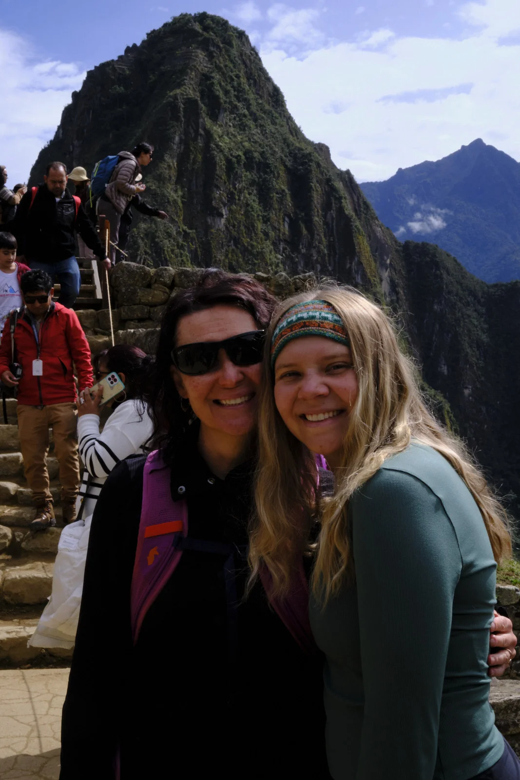 Machu Picchu citadel, Huayna Picchu, and stone stairs behind terrace walls