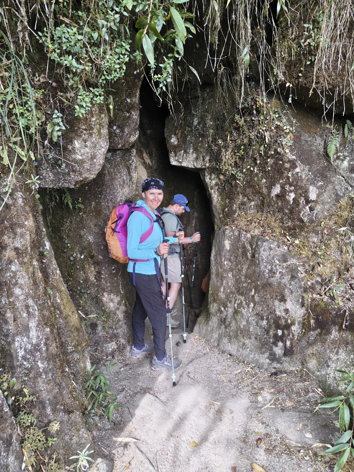 The Inca Tunnel, a narrow cleft through mossy rock on the trail between Phuyupatamarca and Wiñay Wayna
