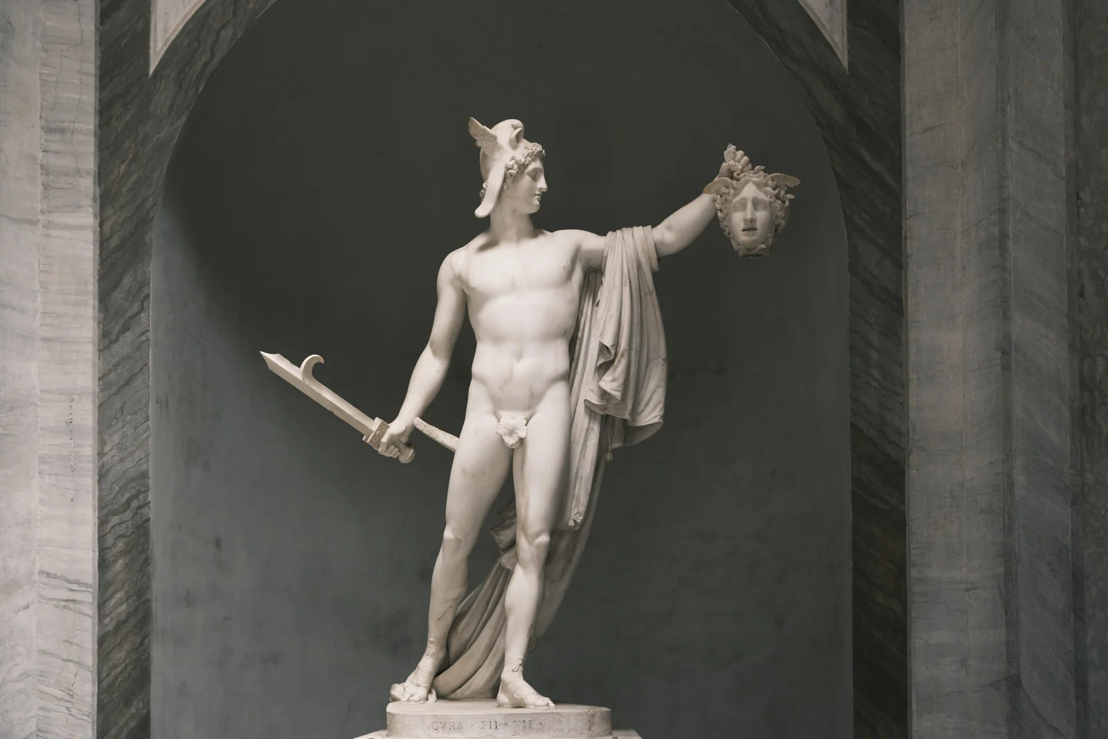 Canova’s marble Perseus holding Medusa’s head in a Vatican niche