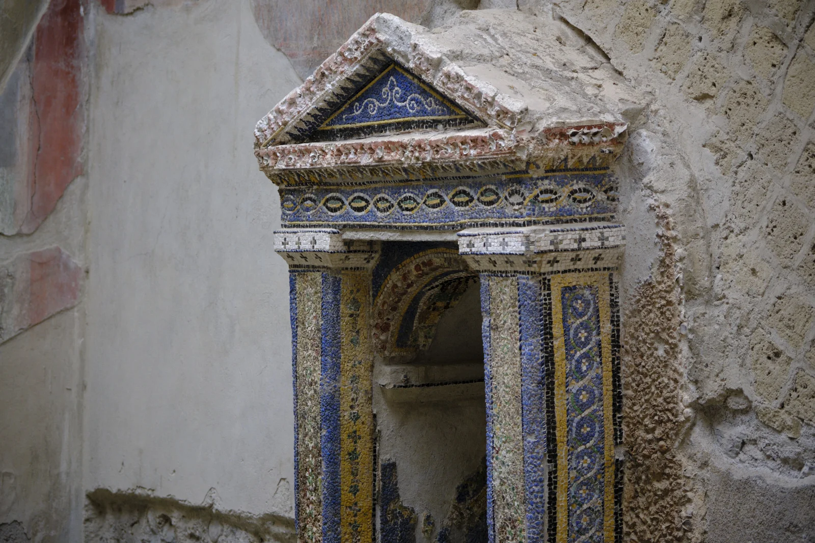Small mosaic aedicula shrine on a wall at Herculaneum