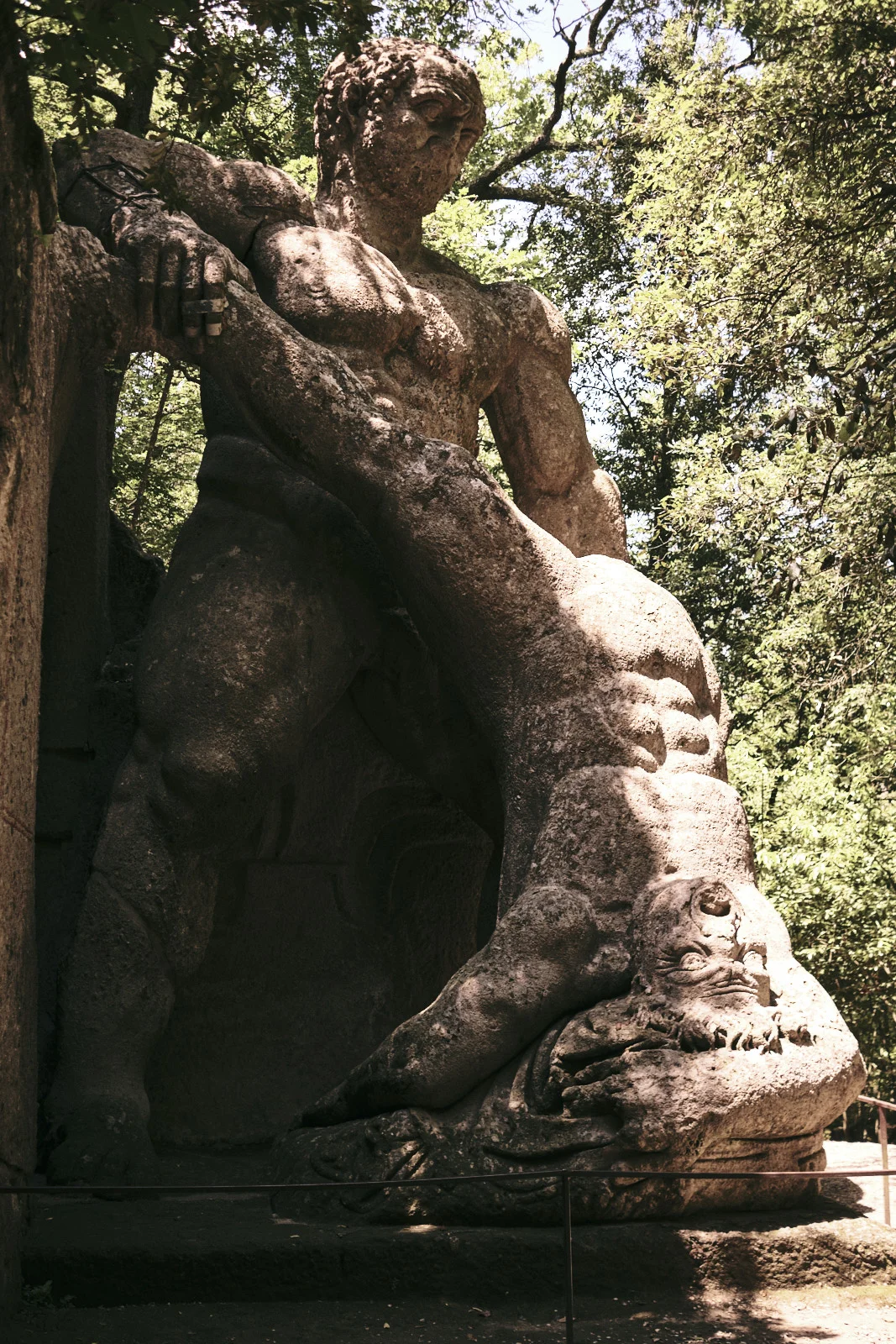 Giant stone Hercules fighting Cacus in the woods at Bomarzo