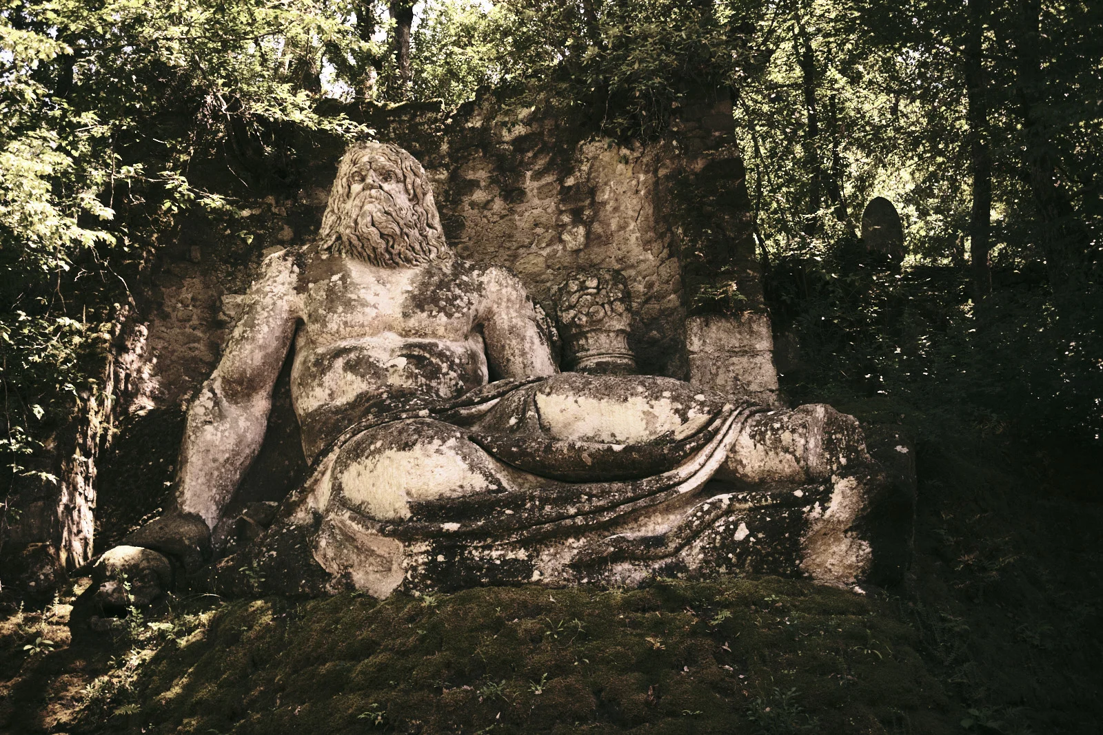 Colossal reclining bearded stone figure at Bomarzo