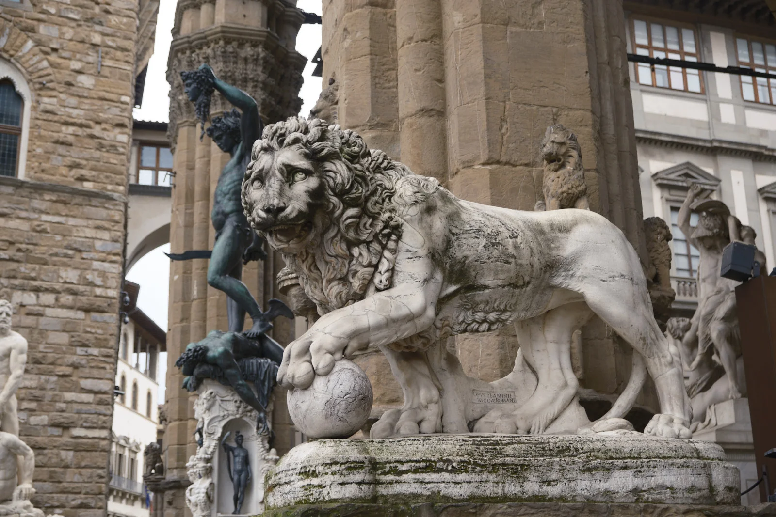 Marble lion with a sphere in Piazza della Signoria