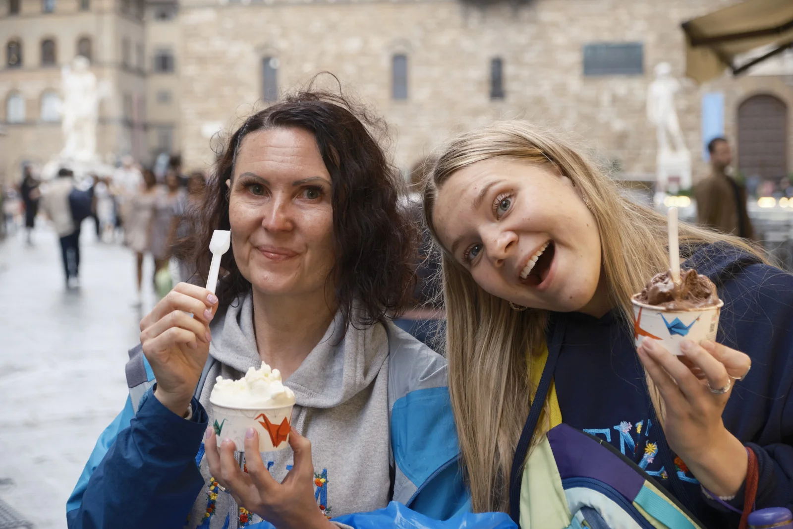 Two people eating gelato in Piazza della Signoria