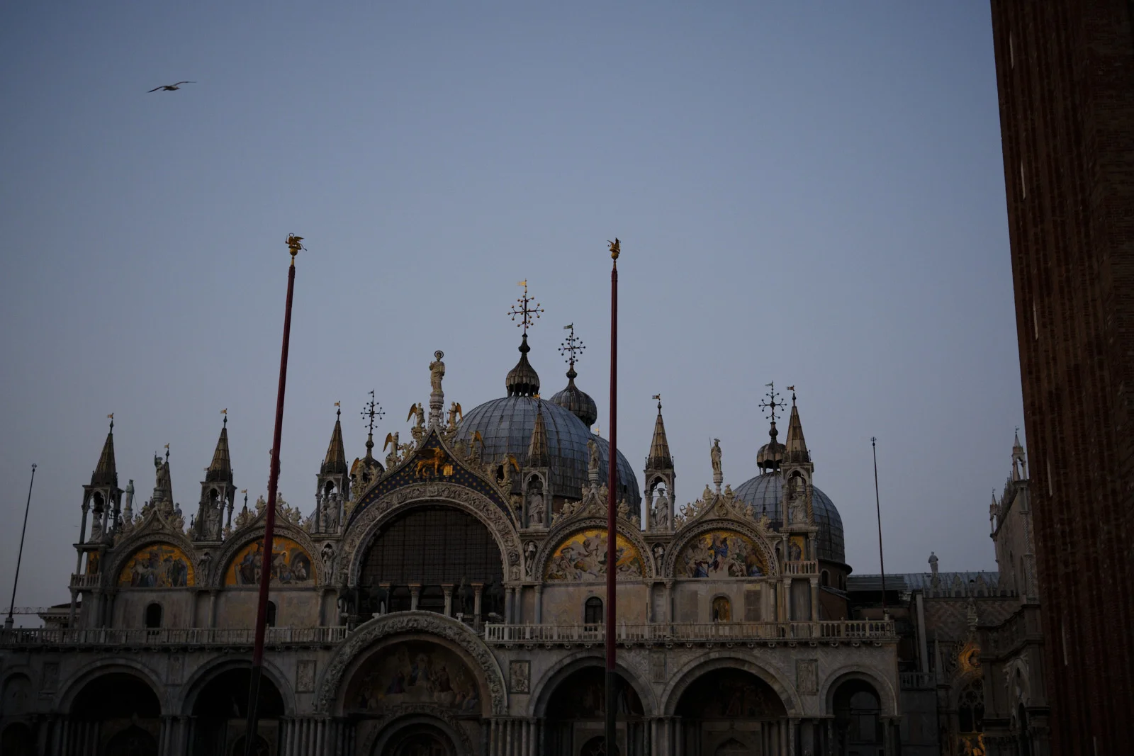 Upper facade of St. Mark’s Basilica with mosaics and domes
