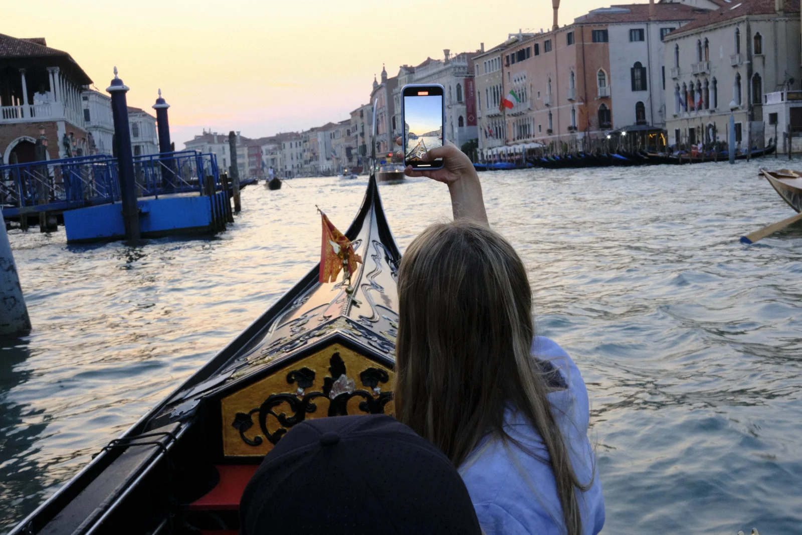 Photographing the Grand Canal from a gondola at sunset