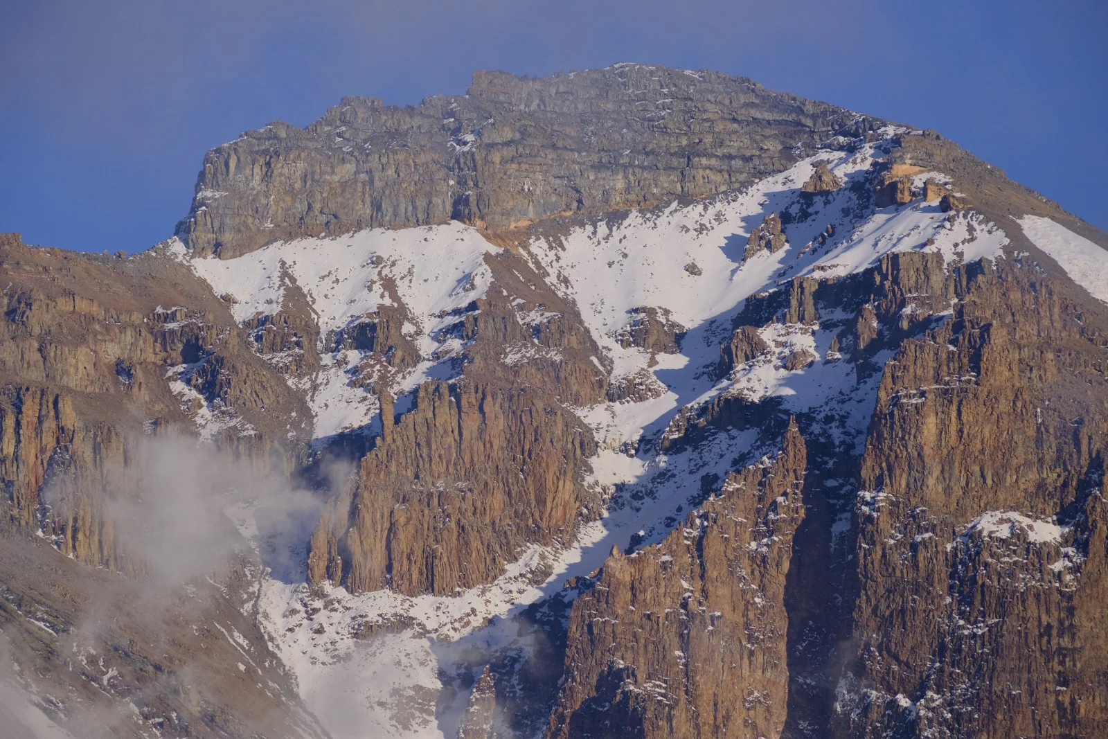 Jagged snow-streaked cliffs of Mawenzi