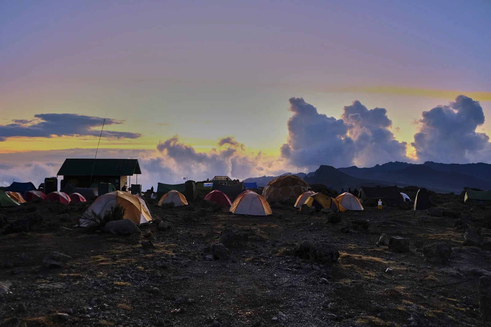 Tents and a hut at twilight on the Shira plateau