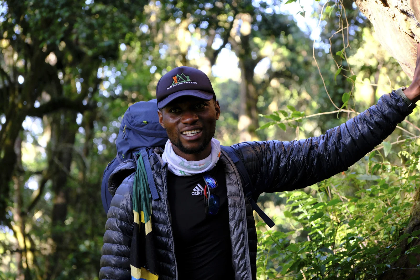 Guide in an Ian Taylor Trekking cap in the rainforest