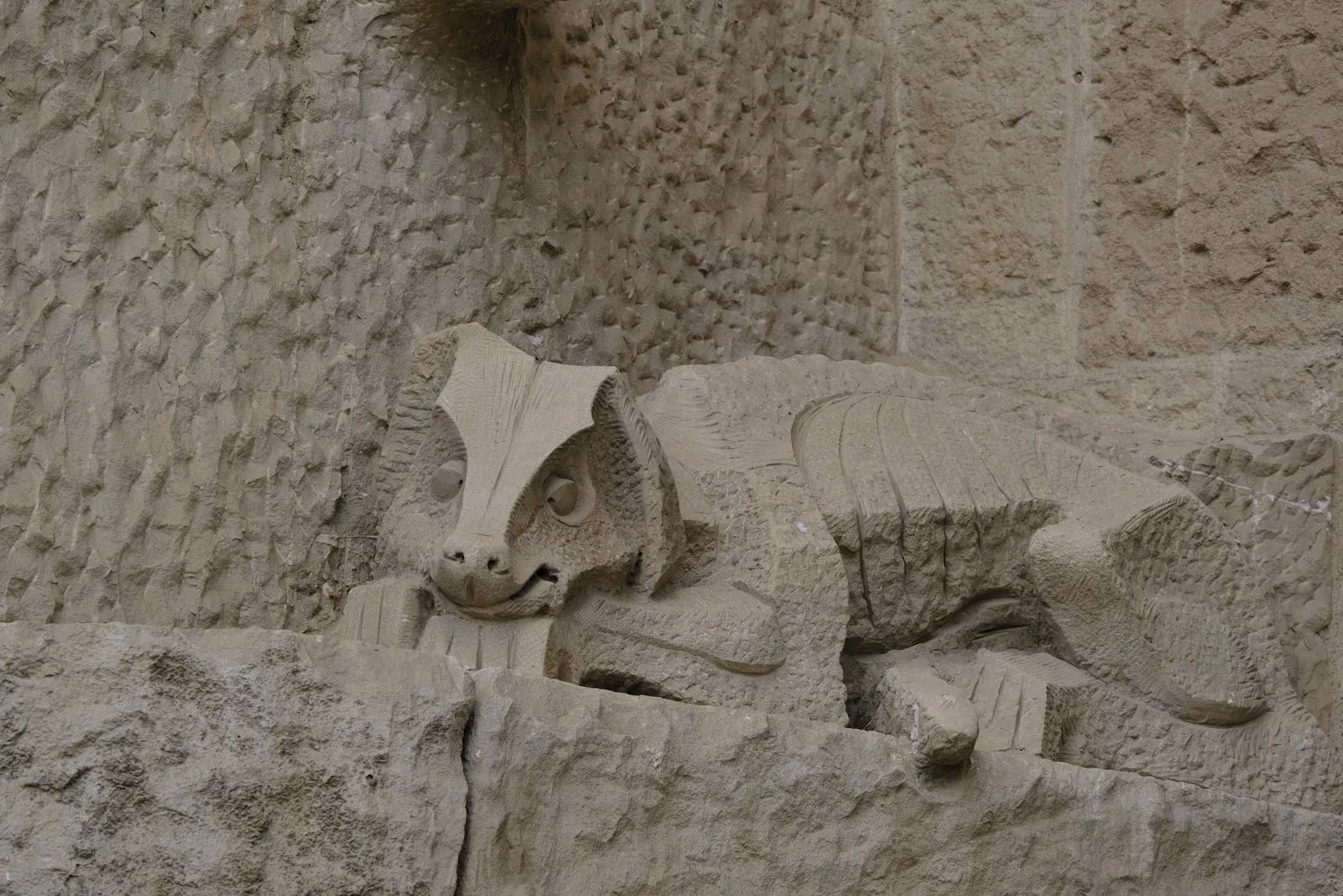 The stone serpent at the base of the Kiss of Judas on the Passion facade of the Sagrada Família in Barcelona.
