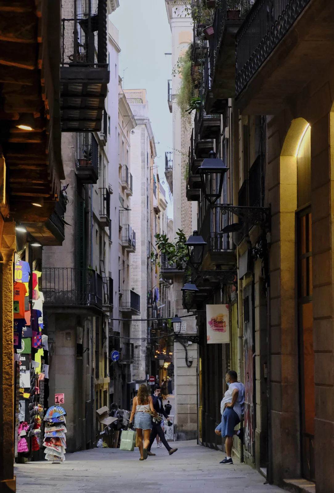 A narrow shopping lane in the Gothic Quarter of Barcelona.