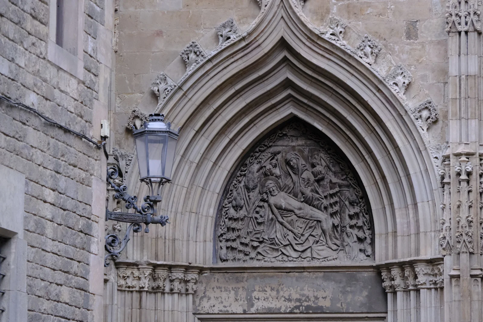 The Door of the Pietà, with its Pietà tympanum, on Barcelona Cathedral.