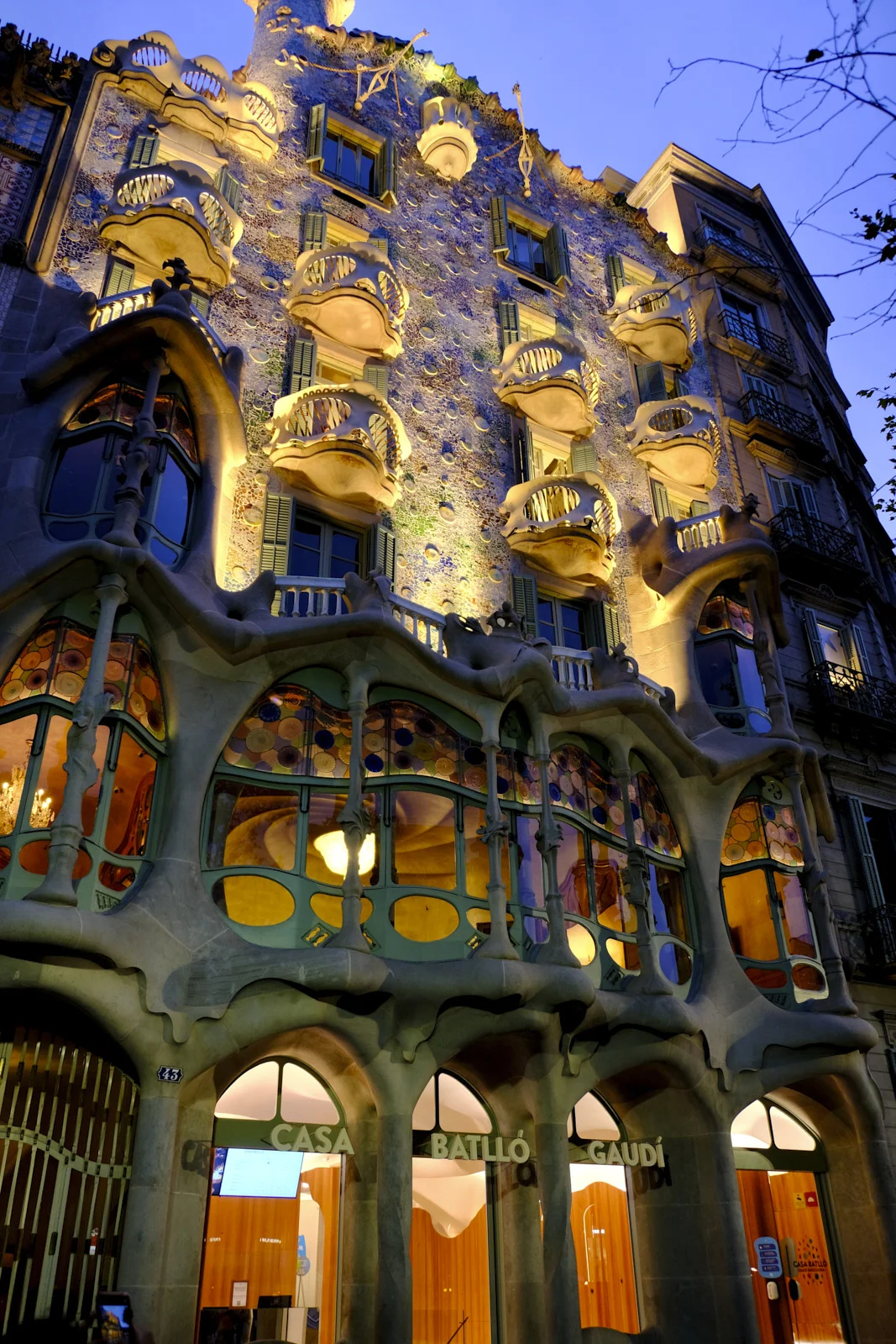 The facade of Casa Batlló in Barcelona, with the Casa Batlló Gaudí sign over the entrance.