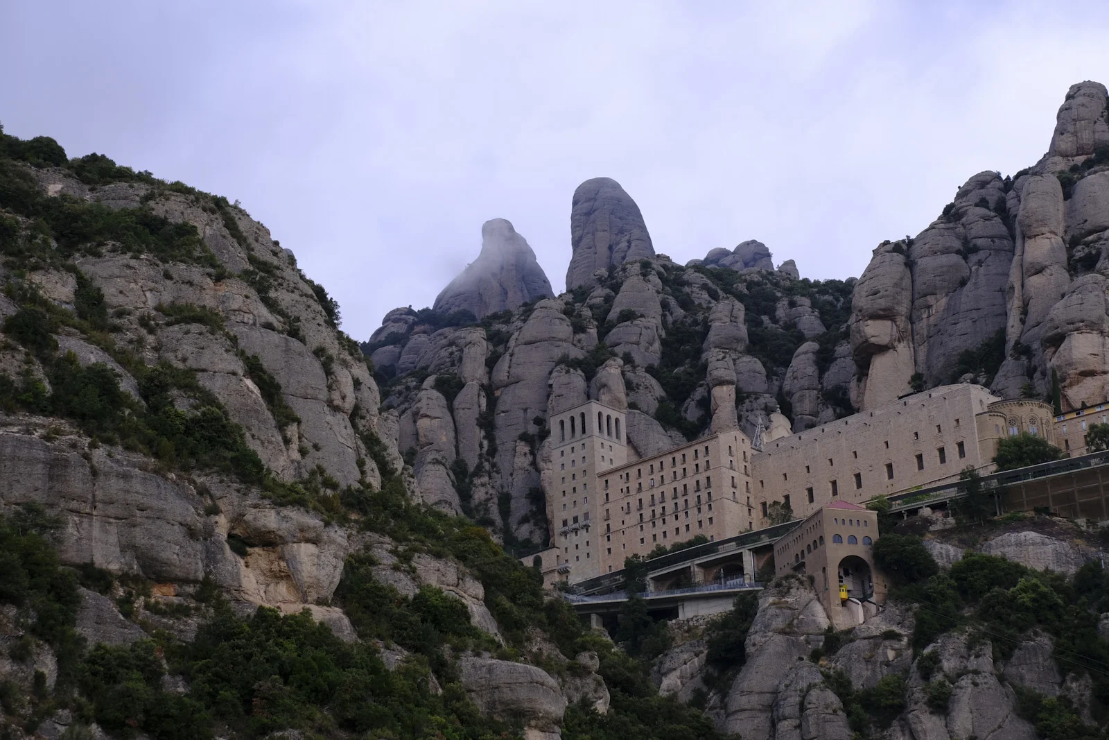 The monastery buildings and a funicular station at Montserrat, set among the rock peaks.