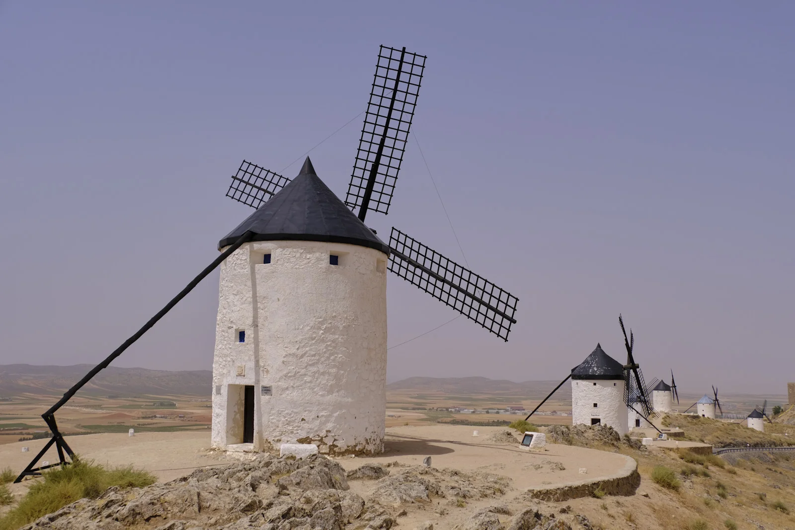 A row of windmills along the ridge above Consuegra.