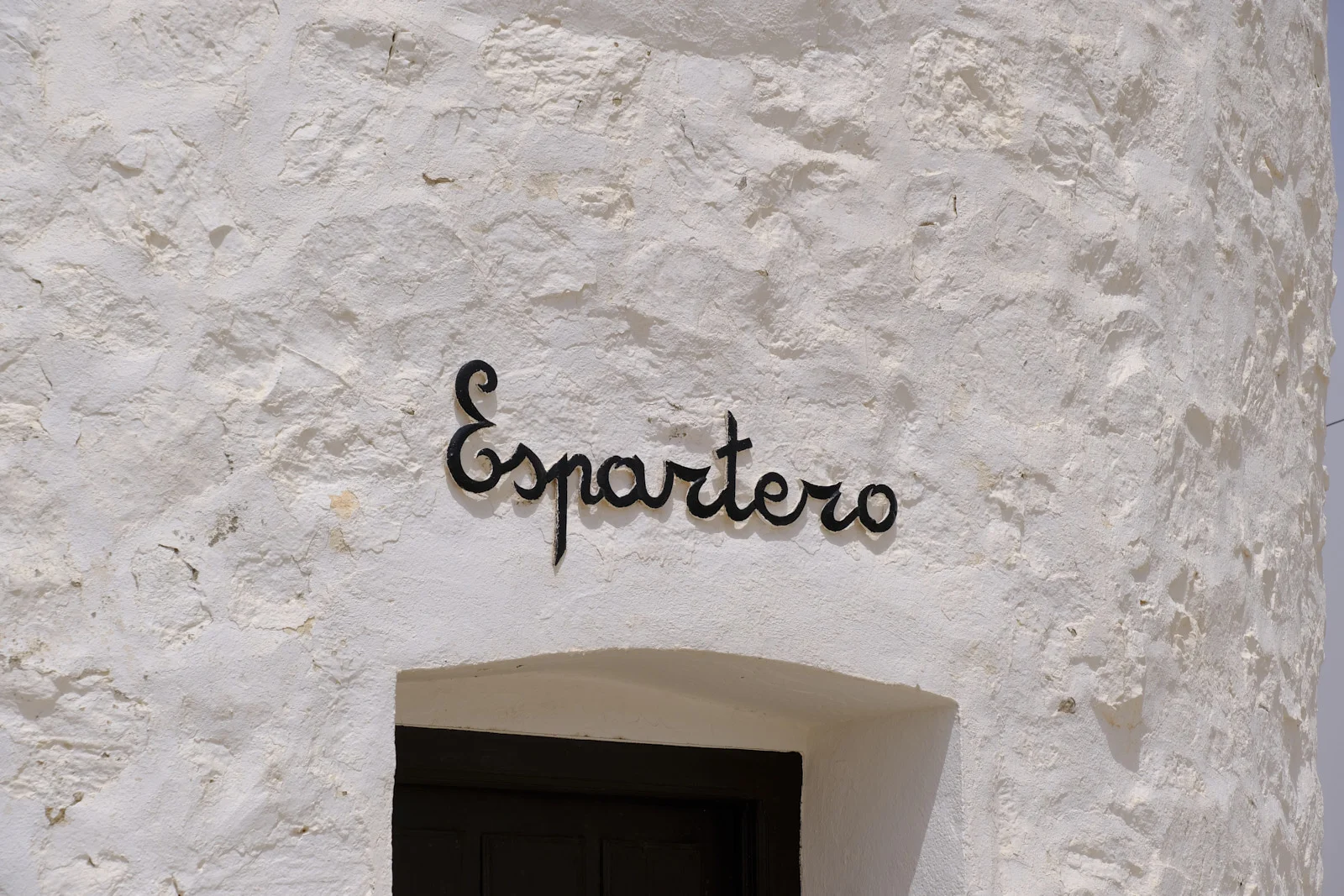 The name Espartero lettered above the door of a windmill at Consuegra.