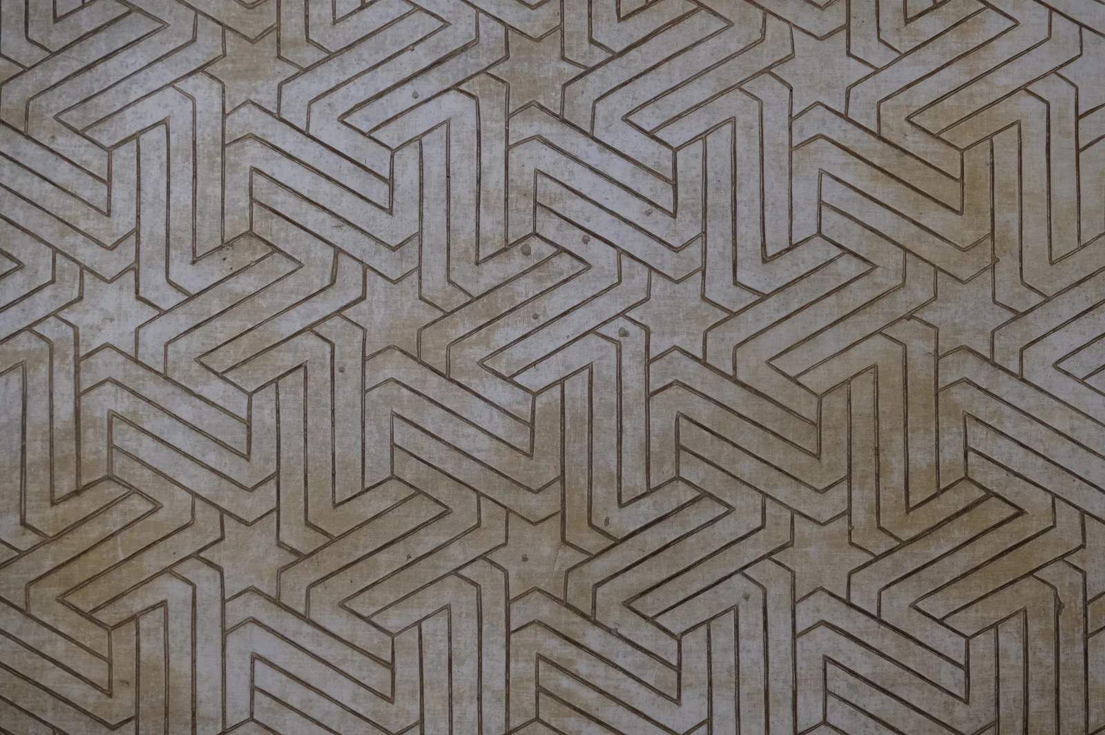 A flat panel of interlocking angular strapwork covering the frame.