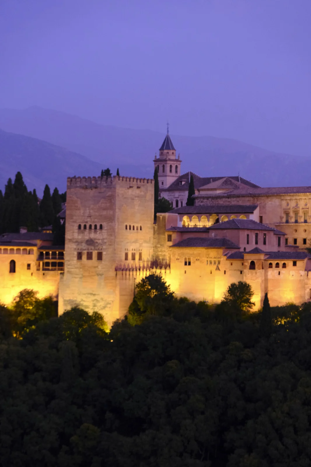 The Torre de Comares and the bell tower of Santa María de la Alhambra, with part of the Palace of Charles V beside them.