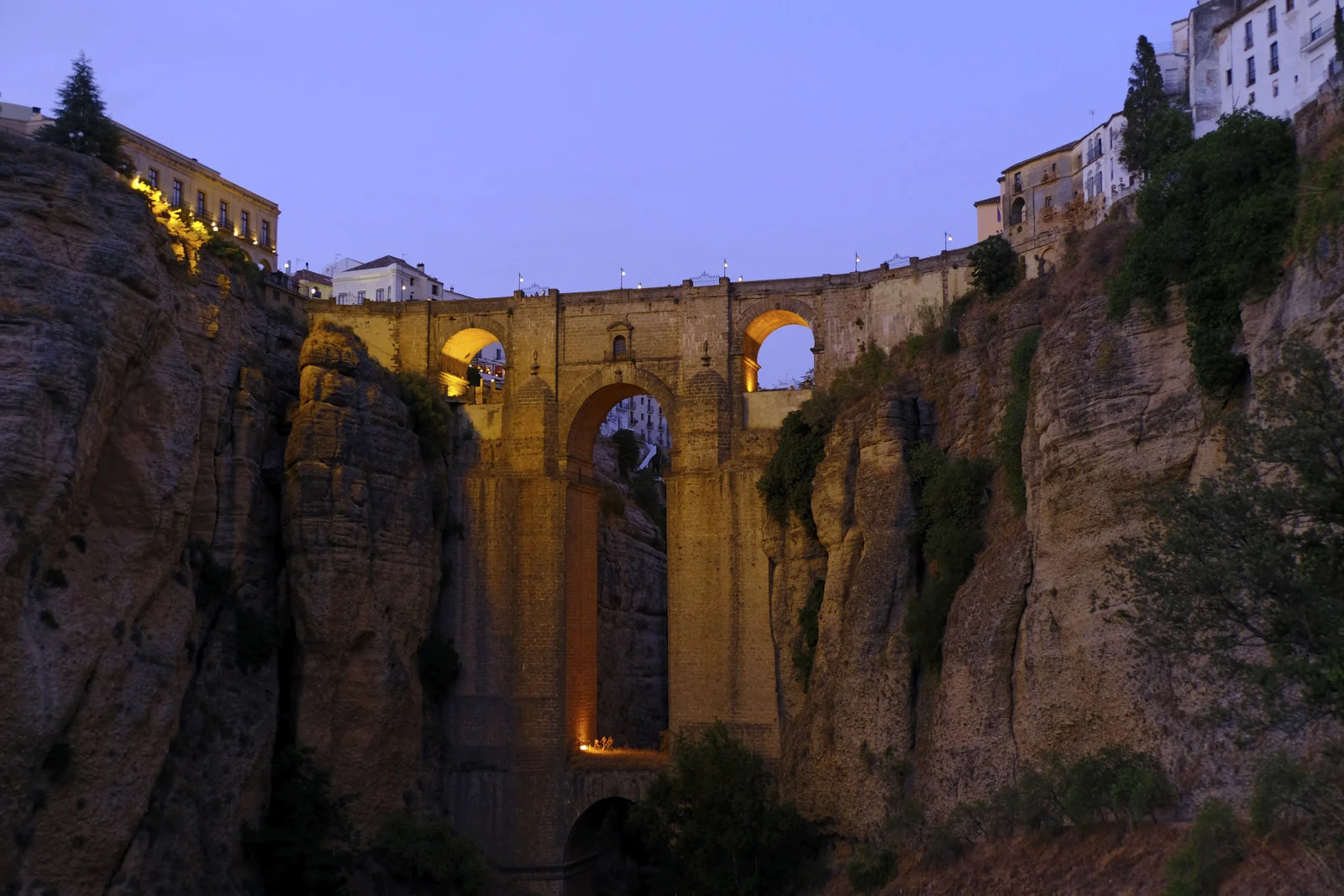 Puente Nuevo spans the gorge at Ronda, with houses along the cliff tops on both sides.
