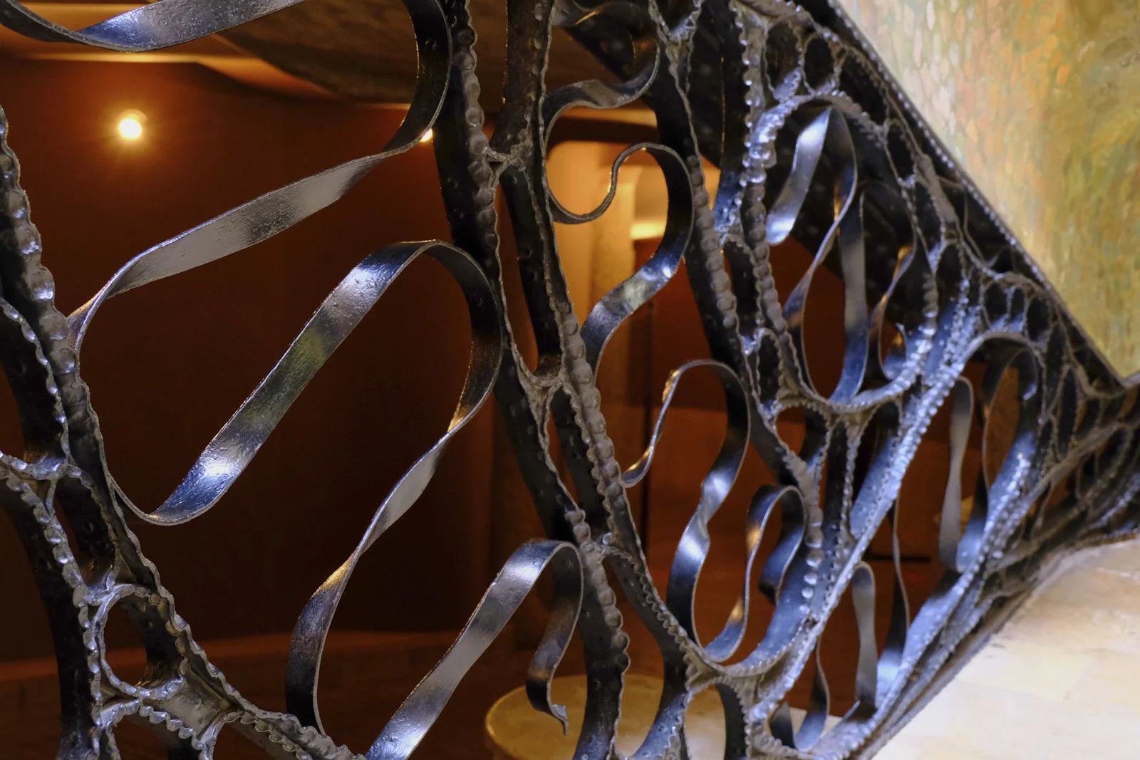 Twisted wrought-iron bars form the gate inside La Pedrera in Barcelona.